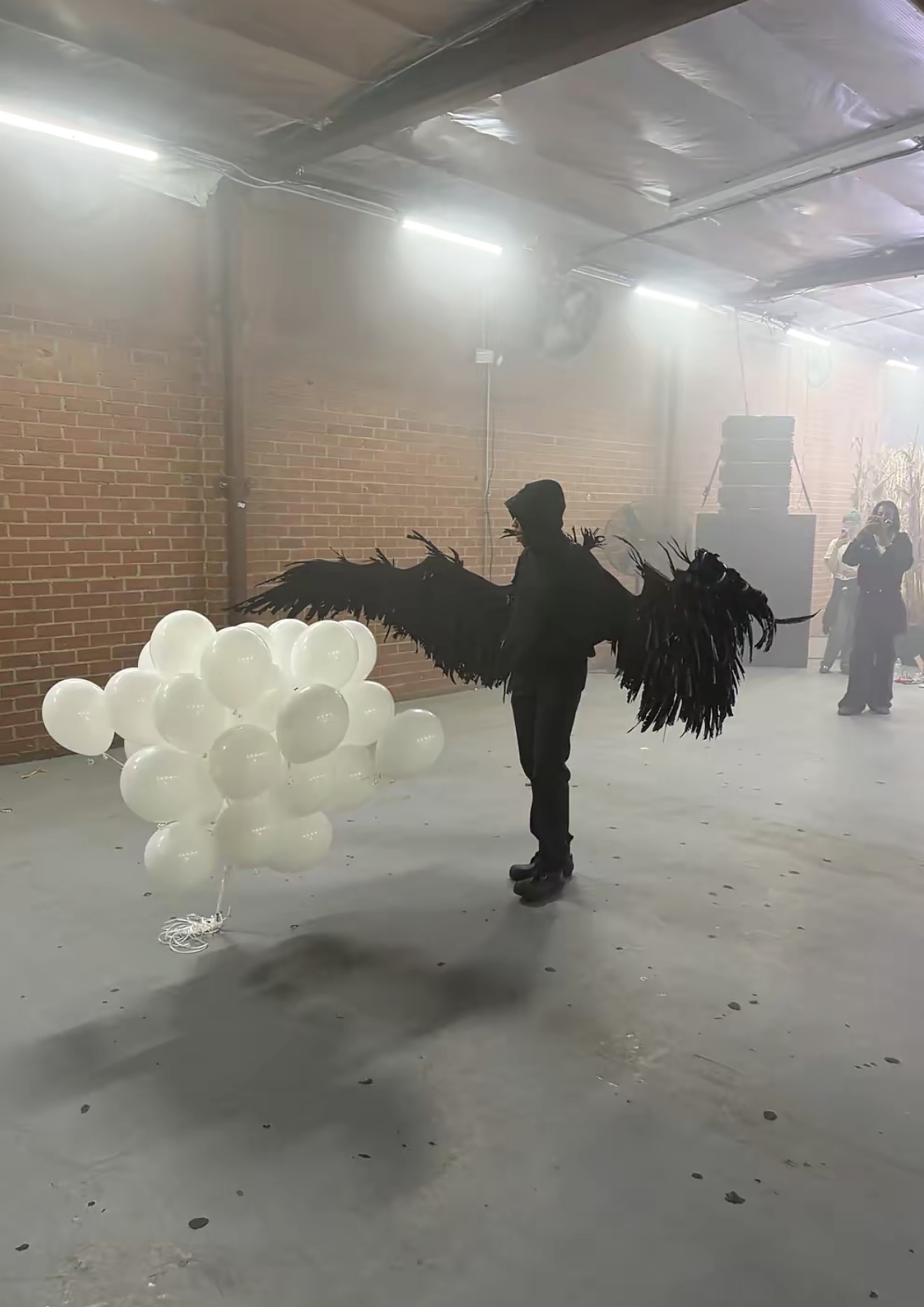 ZAYAMIRA artist portrait with black wings